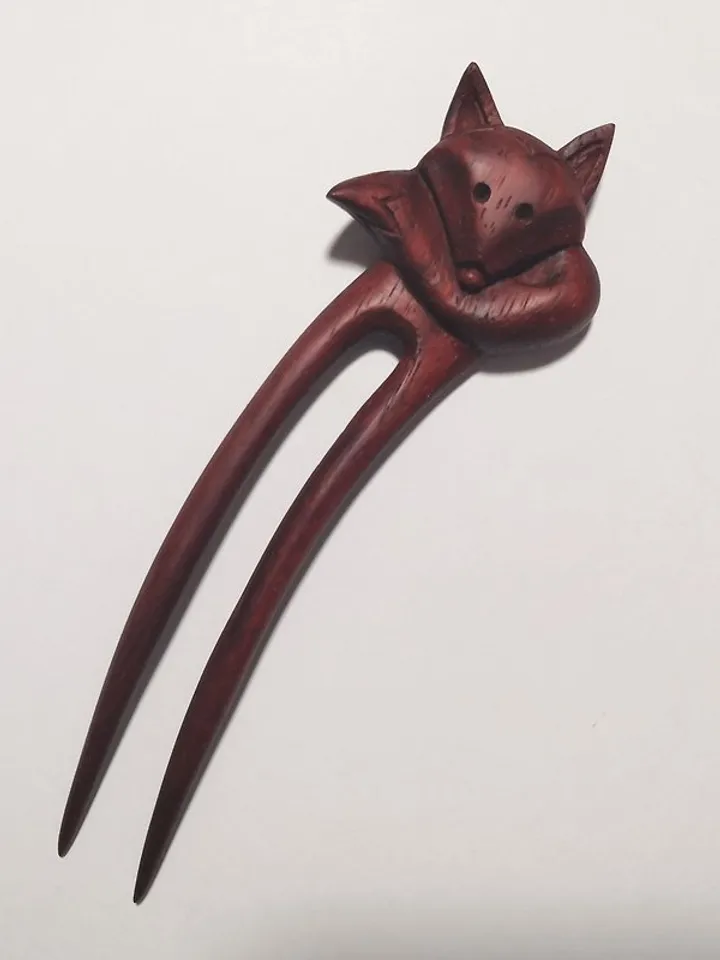 Carved wooden hairpin with a fox.