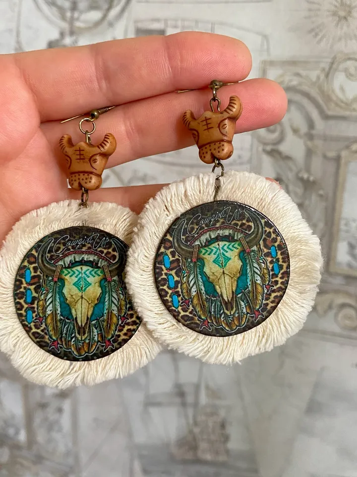 A set of interesting handmade jewelry.Handmade jewelry. Author's design. Set of earrings + pendant on a cord.