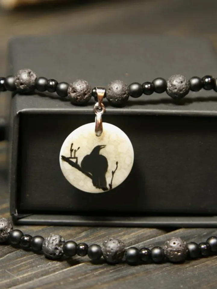 Raven or crow necklace with love rune on the other side. Nacre pearl pendant