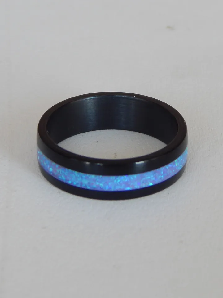 Stylish black ring. Carbon ring with synthetic opal. 7
