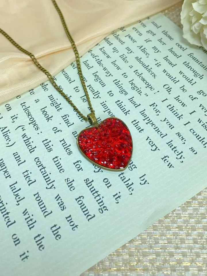 Pendant on a cord. Red heart. Handmade jewelry.3D effect.