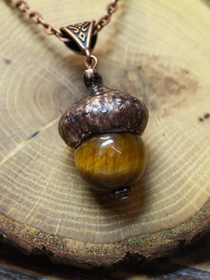 An original handmade electroformed copper pendant made from natural acorn caps in a single copy.