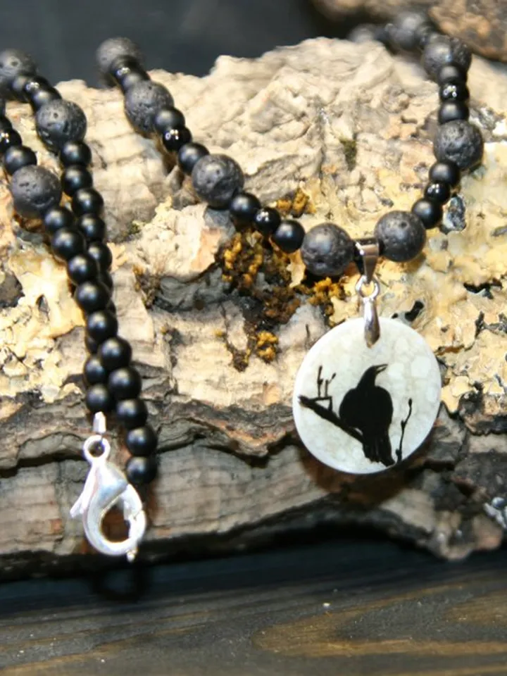 Raven or crow necklace with love rune on the other side. Nacre pearl pendant