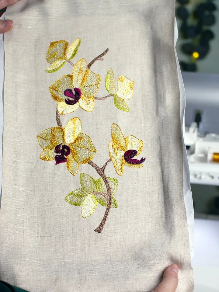 Orchid machine embroidery design using artistic satin stitch technique