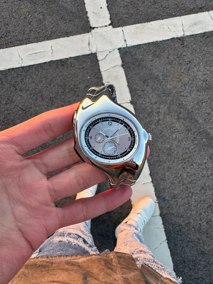 Nike Triax wristwatch: glossy silver case and dial