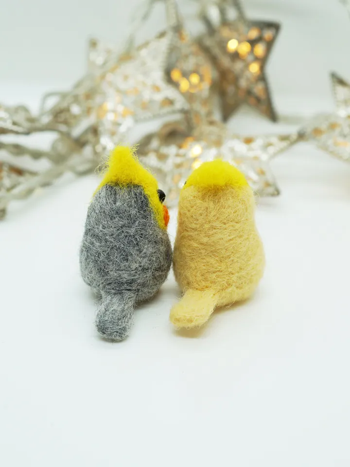 A pair of needle felted miniature cockatiels, made to order.