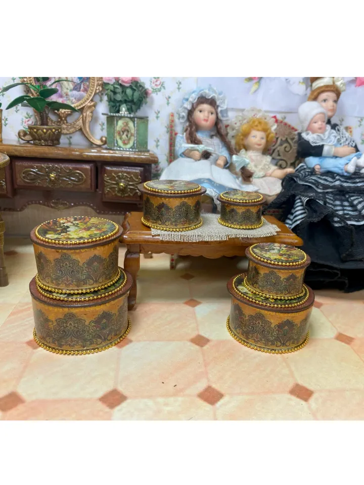 A set of handmade miniature boxes for filling the interior of a dollhouse in 1:12 scale.