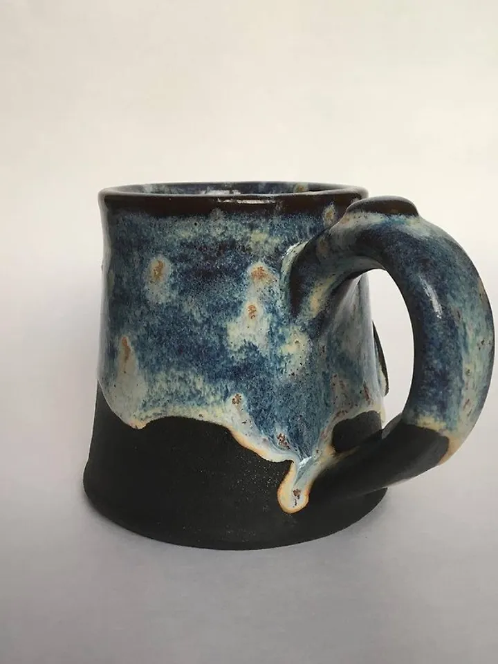 Trinity knot Triquetra in circle blue and black galaxy glazed stoneware mug