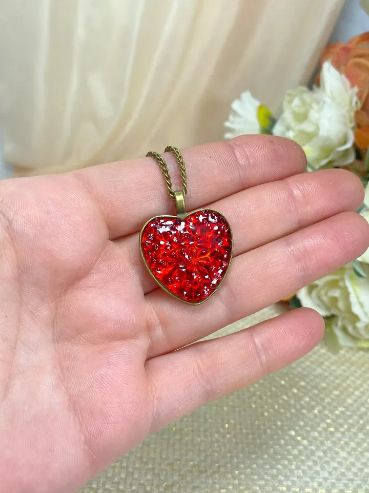 Pendant on a cord. Red heart. Handmade jewelry.3D effect.