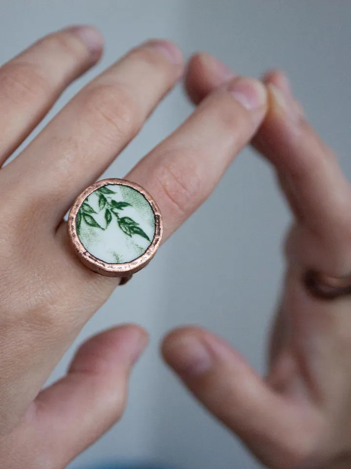 Unique handmade porcelain ring in a copper frame made using the electroforming process