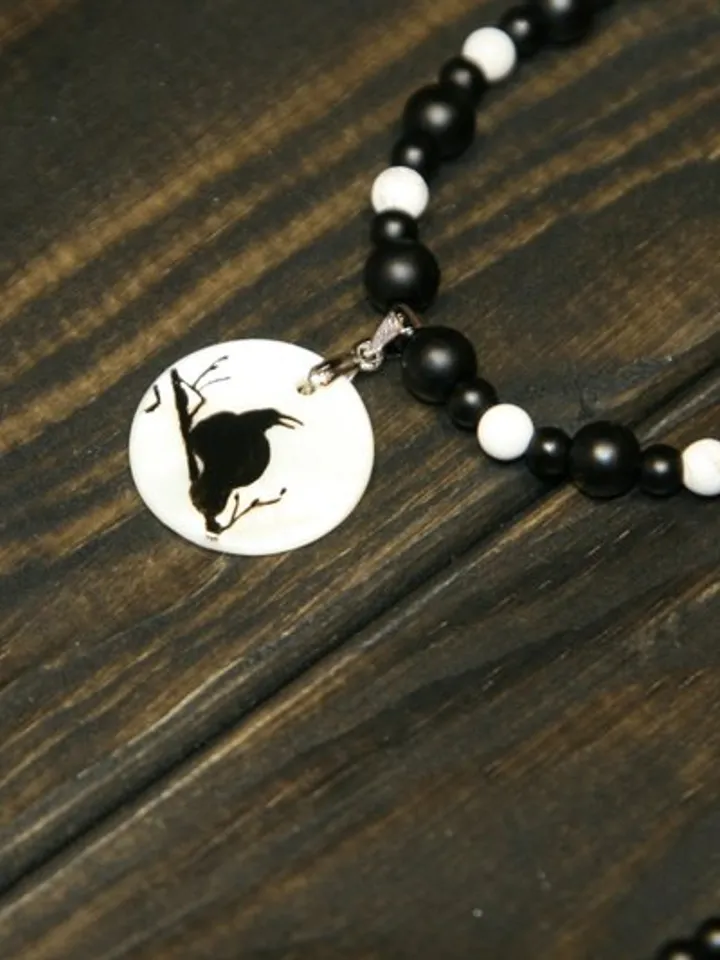Raven or crow necklace with love rune on the other side. Nacre pearl pendant