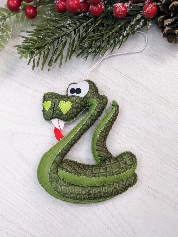 Felt snake. Green snake symbol of 2025 Christmas gift