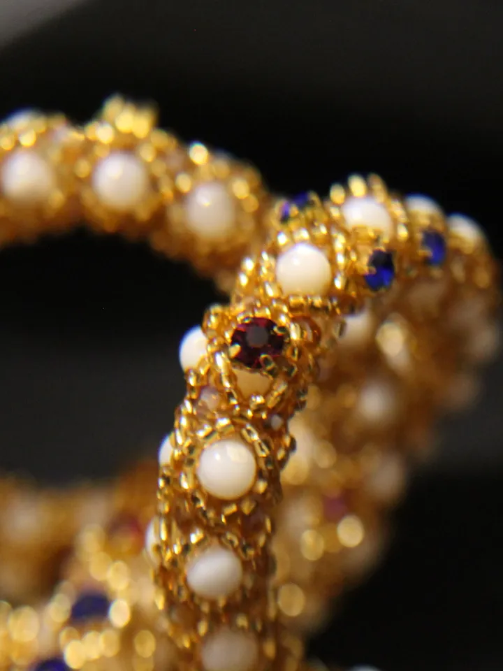 Pendant in the form of a cross woven pearls, mother-of-pearl and beads