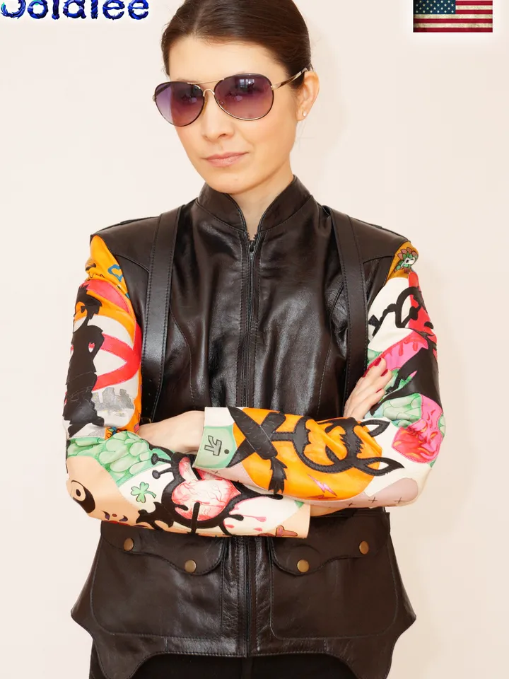 Exclusive women's handmade genuine black leather jacket bright applications sleeves. Painting lamb on leather clothes.