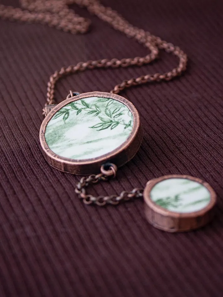 Unique handmade porcelain pendant in a copper frame made using the electroforming process