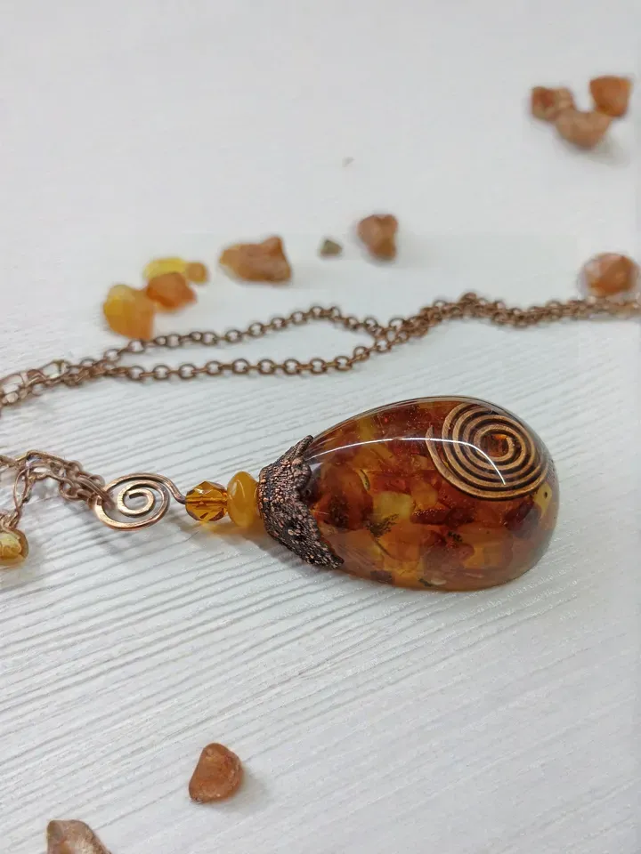 Amber Orgone pendant necklace. Raw Baltic amber chips and a copper spiral in clear eco resin powerful protection necklace generating Orgone energy