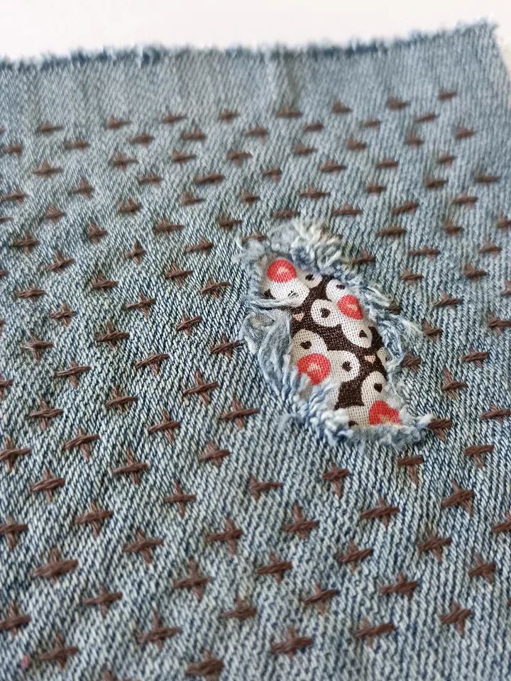 Upcycled denim boro patch. Sashiko stitching.