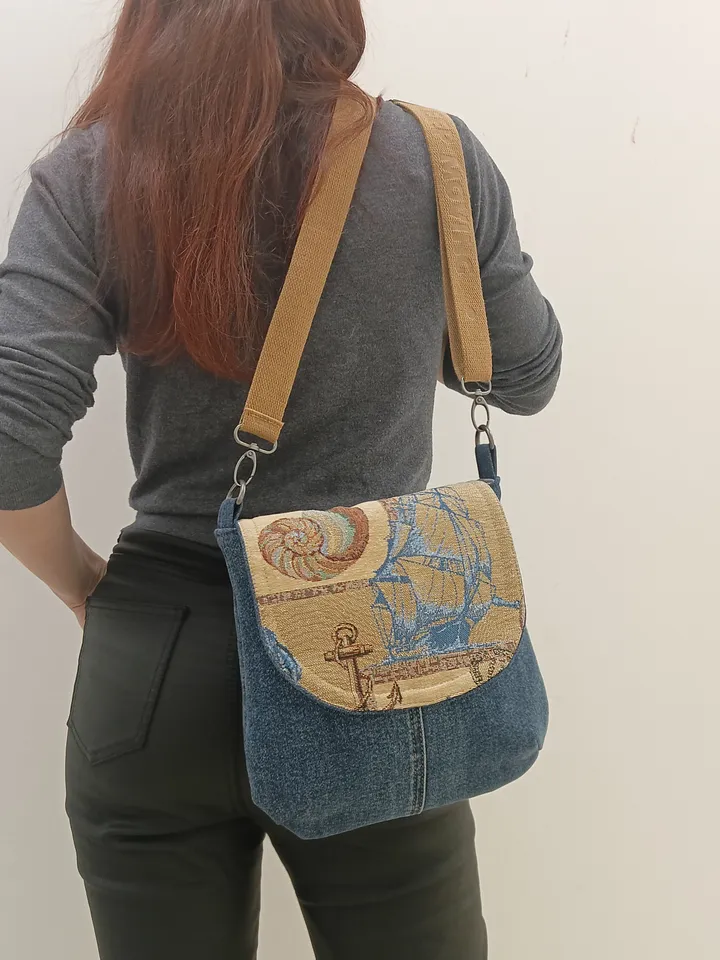Cute crossbody denim bag, a women's messenger bag with a tapestry flap with a marine theme pattern and denim shoulder bag with 4 pockets inside and an adjustable strap.