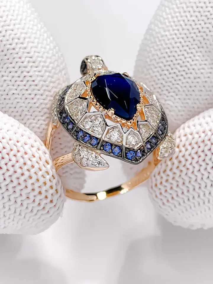 Ring Silver gold plated 925 assay value with sapphire