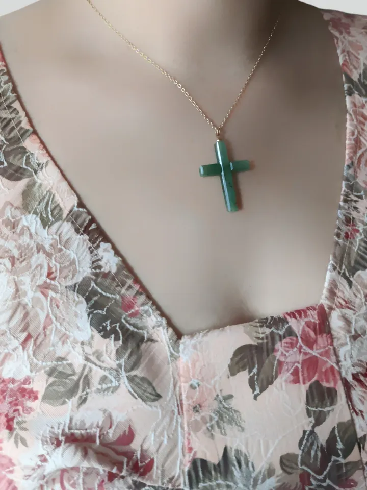 Christian cross pendant green jade on a gold plated chain.