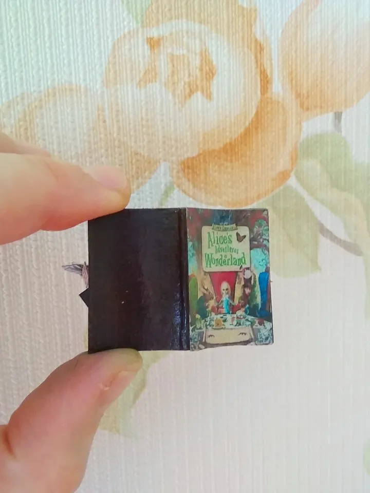 Open book. Dollhouse miniature.Miniature for a dollhouse.1:12 scale.