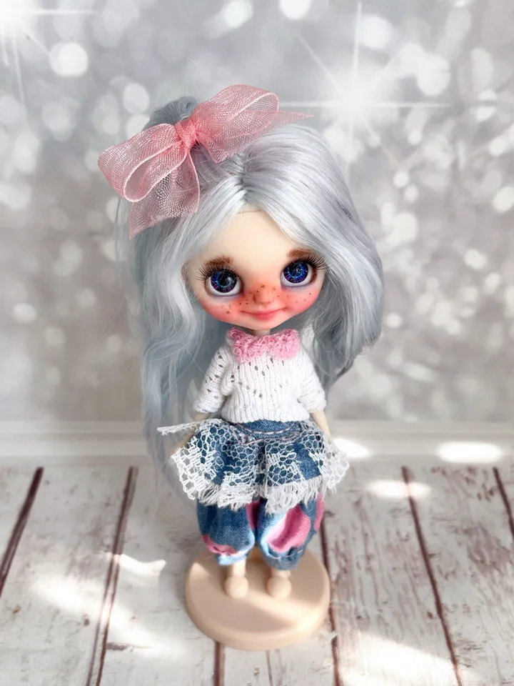 Small Blythe doll with blue eyes. Beautiful miniature Blythe doll with blue hair.