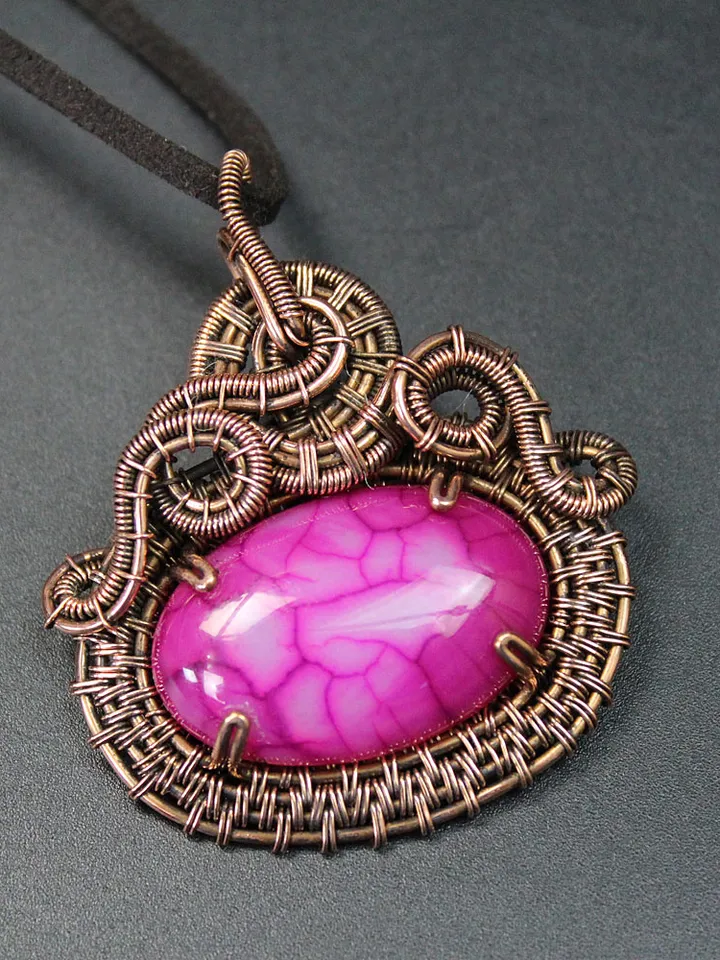 Handmade copper wire and stone pendant.