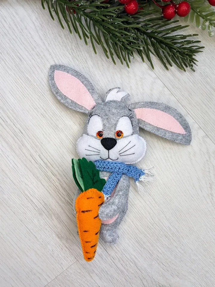 Gray hare with felt carrot. Rabbit with a blue scarf. Gift for a child.