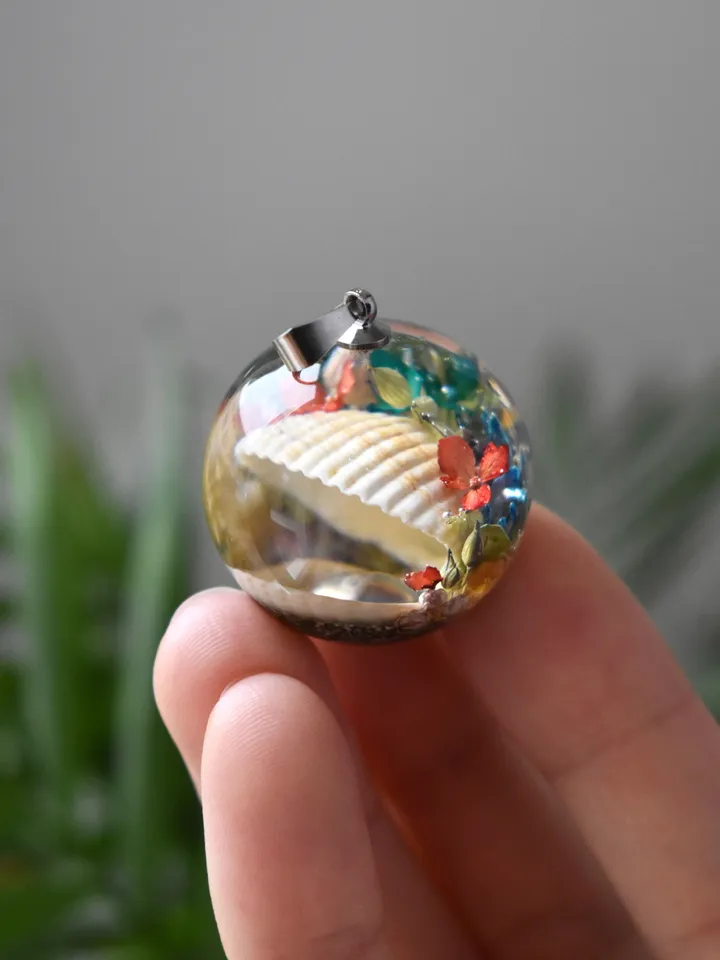 Shell with a pearl pendant. Sea pendant with shell, pearl and real flowers. Pinctada pendant.