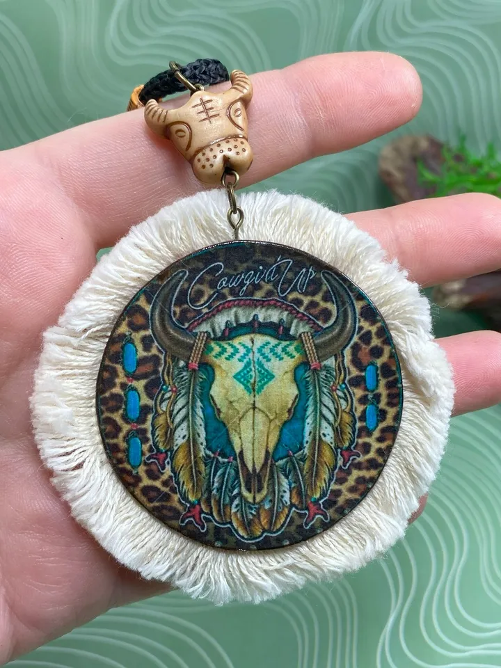 A set of interesting handmade jewelry.Handmade jewelry. Author's design. Set of earrings + pendant on a cord.