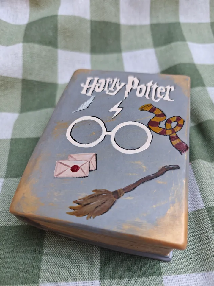 Candle in a plaster form of a book