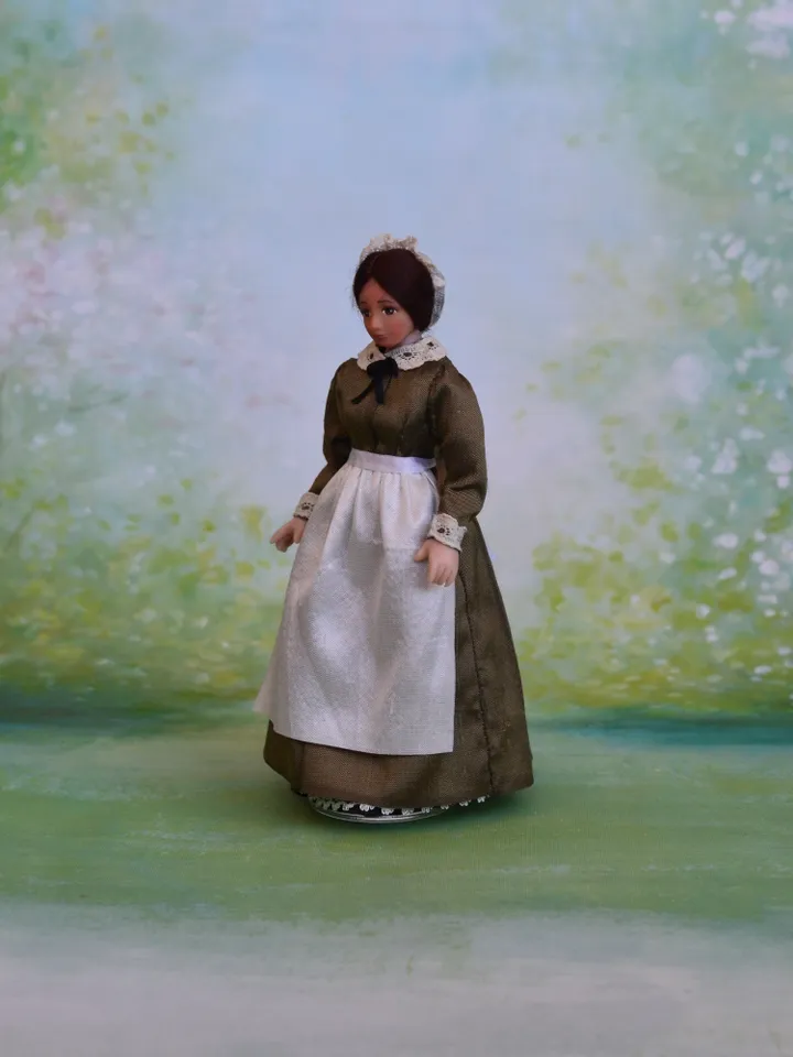 Miniature nanny doll for Victorian dollhouse in 1/12th scale.