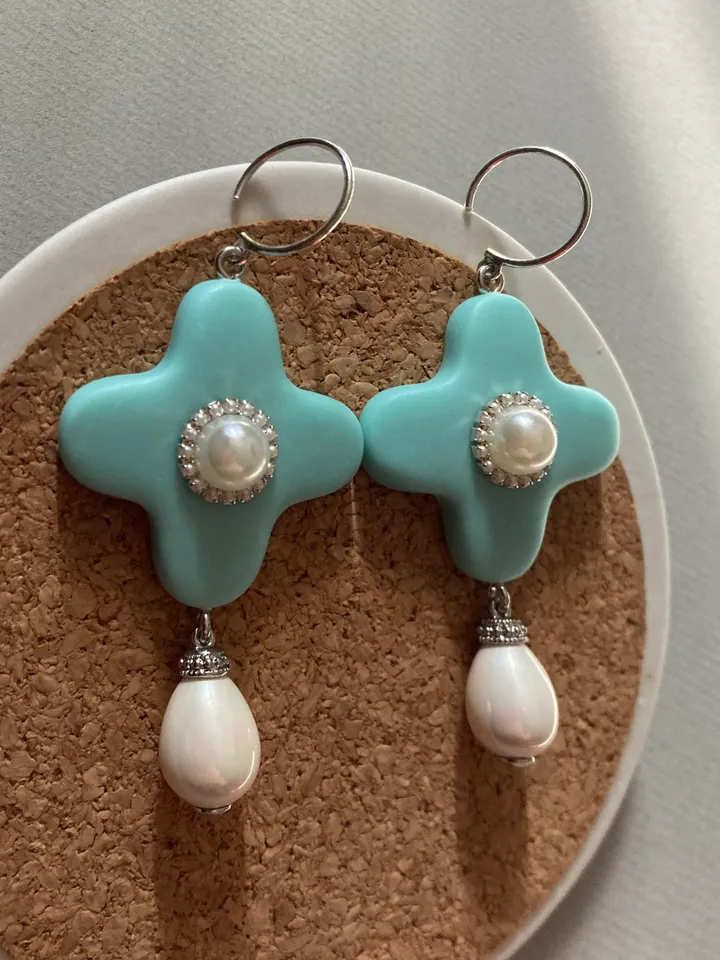 Earrings are handmade from polymer clay