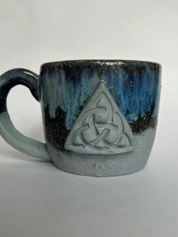 Trinity knot Triquetra in circle blue clay and black galaxy glazed stoneware mug