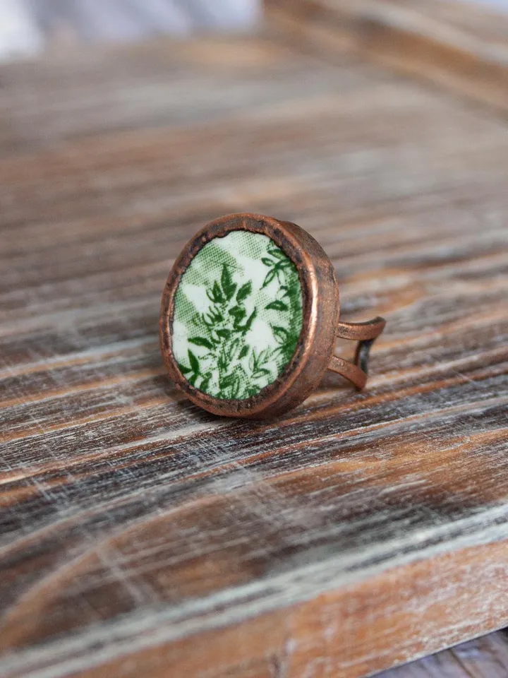 Unique handmade porcelain ring in a copper frame made using the electroforming process