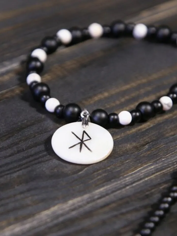 Raven or crow necklace with love rune on the other side. Nacre pearl pendant