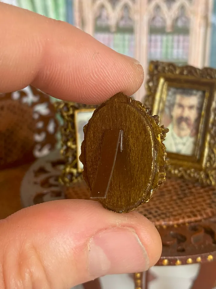 A set of photo frames for a dollhouse. Dollhouse miniature. 1:12. Dollhouse accessories.