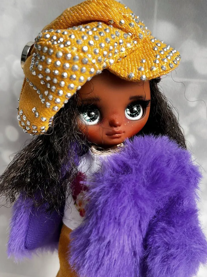 Petite Blythe with dark skin. Adorable miniature doll on an articulated body.