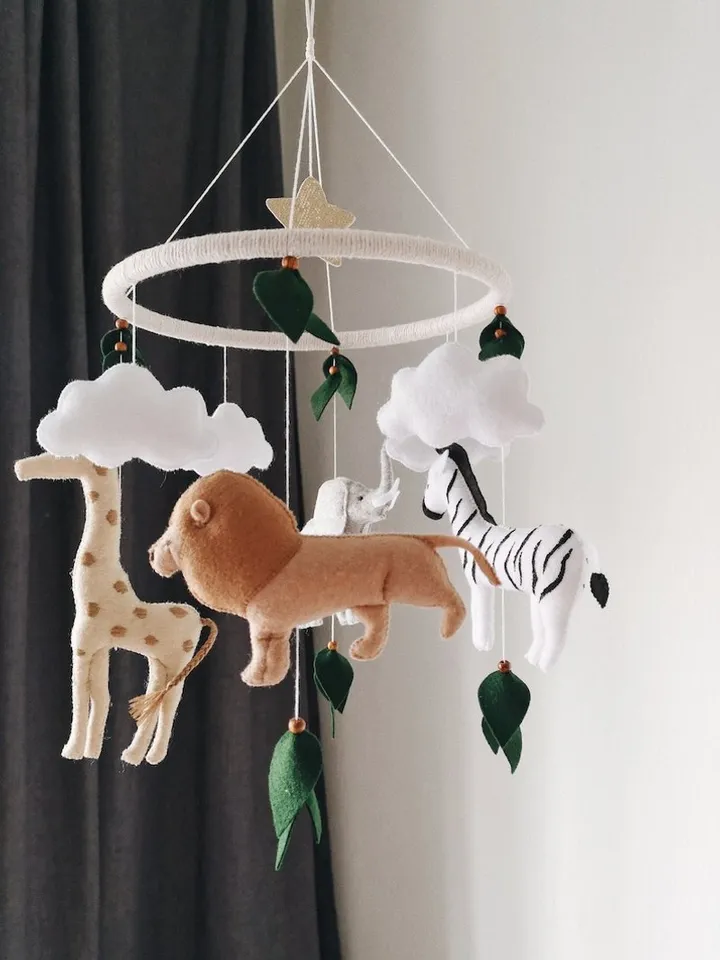 Safari mobile baby nursery decor crib