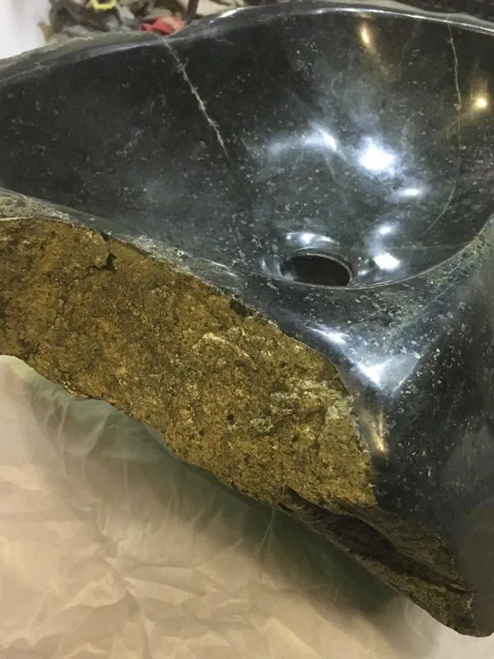 An exclusive sink made of natural stone is a coil.