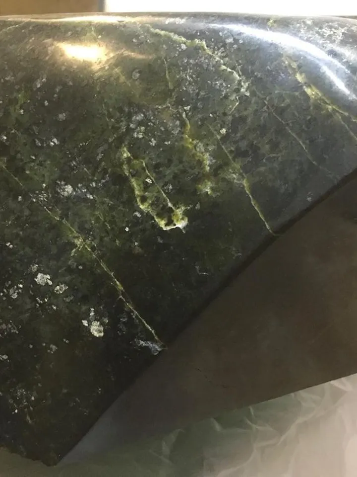 An exclusive sink made of natural stone is a coil.