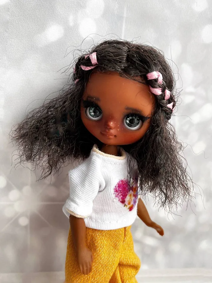 Petite Blythe with dark skin. Adorable miniature doll on an articulated body.