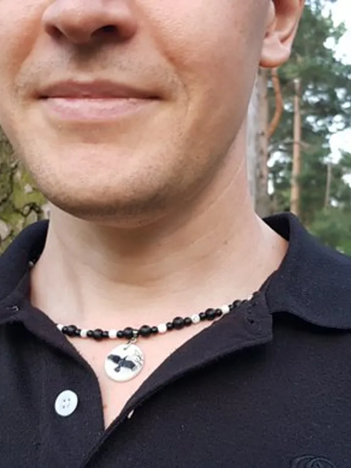 Raven or crow necklace with love rune on the other side. Nacre pearl pendant