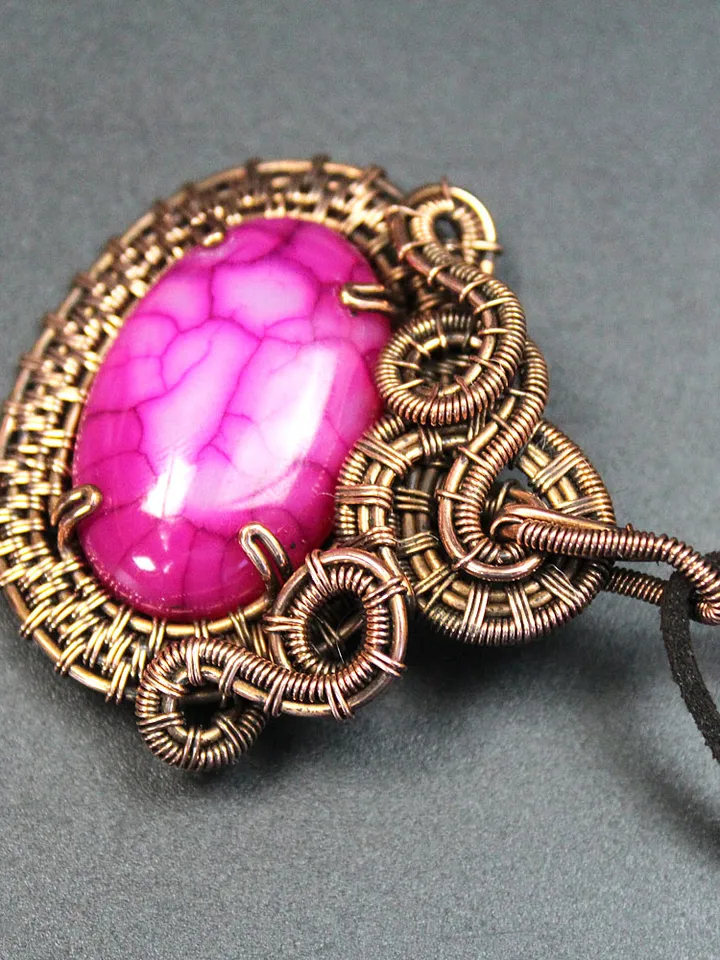 Handmade copper wire and stone pendant.