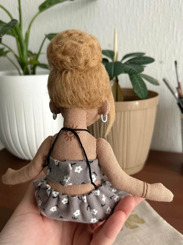 Textile doll yoga girl with blonde bun and tattoo
