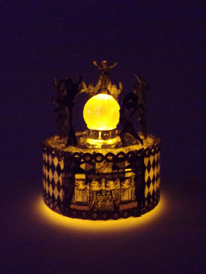 Mini circus with lights. acrobats on stage. LED candle