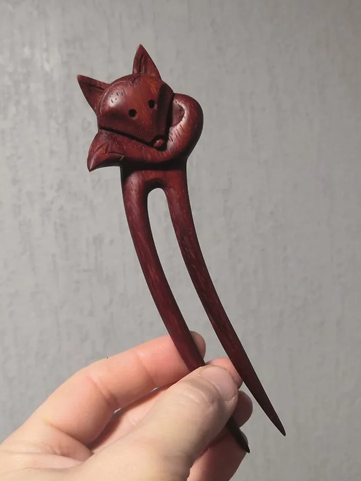 Carved wooden hairpin with a fox.