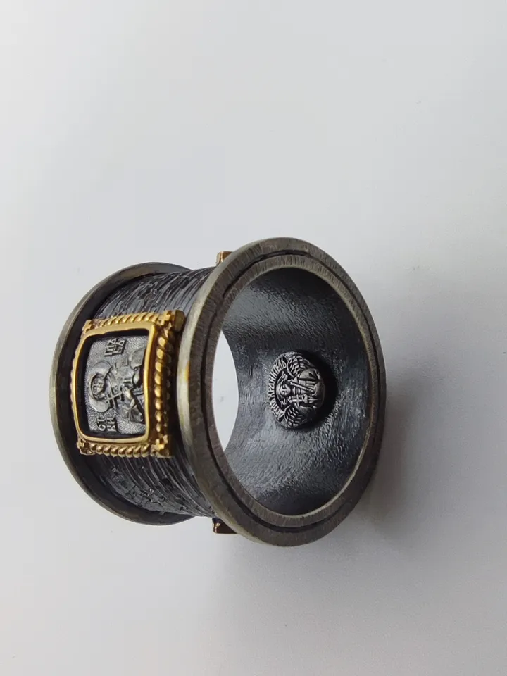 Gorgeous ring with faces of saints