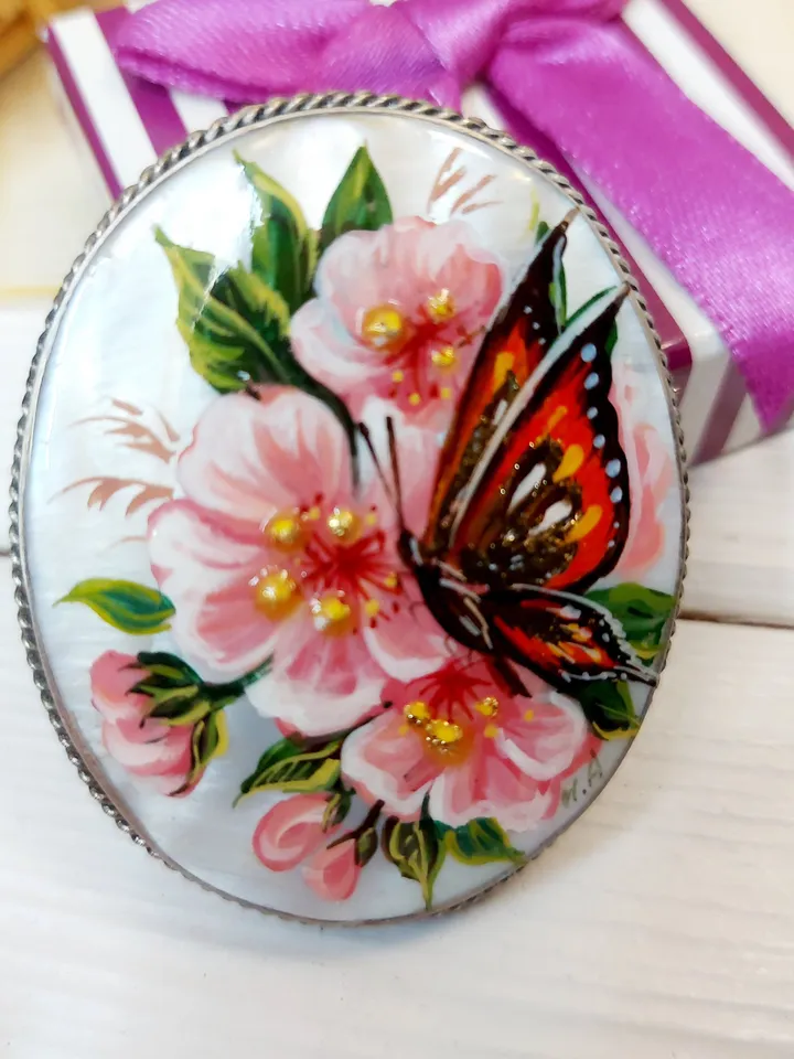 Brooches for women: A delicate butterfly on wild rose blossoms mother of pearl pin, hand painted pink floral brooch made from shell