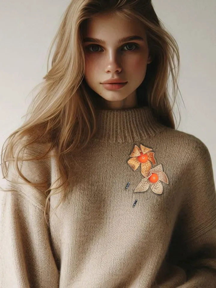 Machine embroidery design of paired Physalis brooches